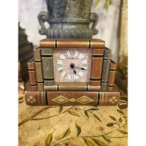 Howard Miller decorative mantel clock designed as stacked books.